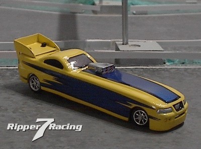 Mustang Funny Car
[b][i]continued...[/i][/b] After building the dragster it looked kinda funny sitting next to ordinary bits so I decided it needed a counterpart for it, so what better than a Funny Car. It sports a stretched bit chassis, a stretched ZZ mustang body, and uses the same 4-cell battery pack. 
ripper7777777 - www.ripper7racing.com
Keywords: ripper7777777 Dragster Mustang Funny Car