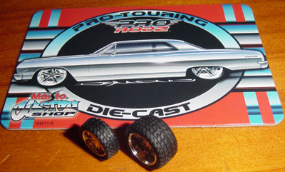 Maisto Original
Stock tires (which are not that bad grip wise) with the "trading card" for reference
