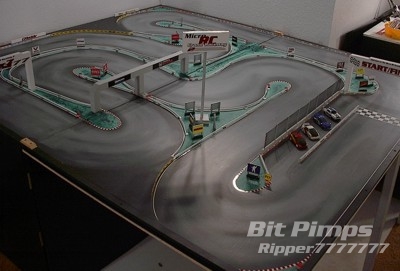 Micro RC Grand Raceway 2
This Track replaced the Original Micro RC Grand Raceway. When I stepped up into the epoch realm I needed a little more space. This track is also great for dual cell ZZ's and Bits, plenty of room to test the throttle. The track itself folds back up on to the table and the Overall Dims are 8'x7' and the average lane width is 12". I hated destroying the other track but once this one was complete, I quickly forgot the old track.
