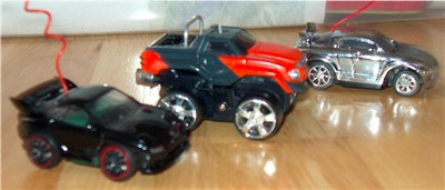 The first few rides to come out the shop.
The Black car is a Shen with a Perfection 4.2 and Import Racer Wheels. The Truck is a Microsizer with Wheels off of some HotWheels truck and some chrome foil accents with a Diamond plate bed made from a peice of metal window screen and painted silver till it was fully covered. The last car, the Silver one is a stock ZZ with Bit wheels and the Chrome X-men body.  
 
  
           
  

